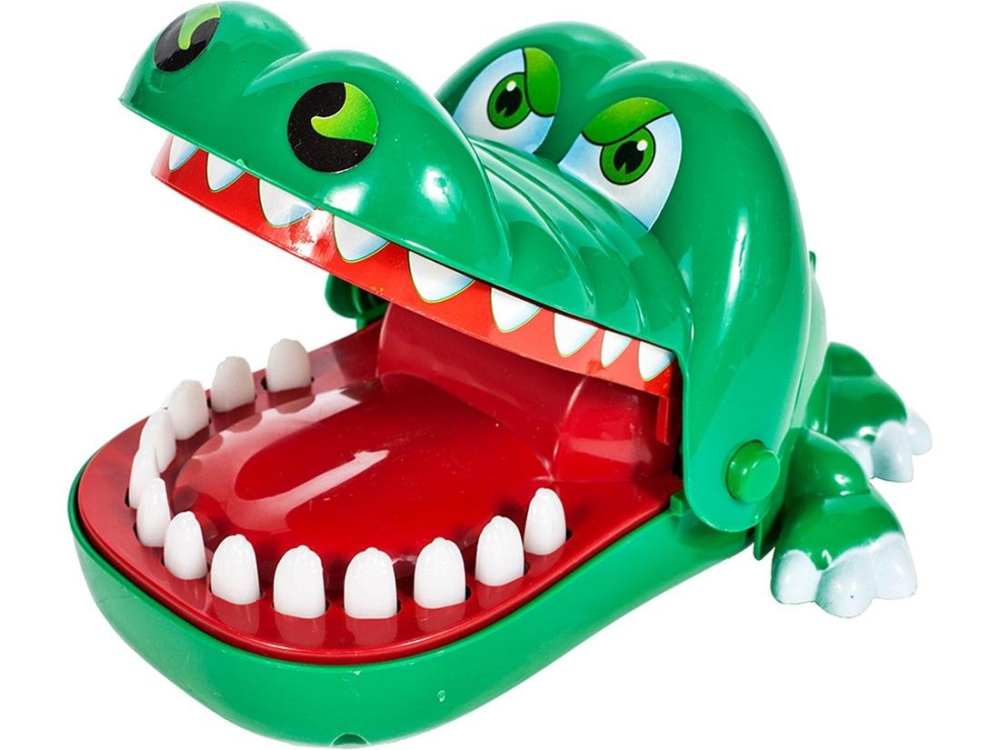 krokodyl-u-dentysty-chory-zabek-gra Zabawka - krokodyl z otwartą paszczą, w której dzieci naciskają zęby, uważając, aby nie wywołać zamknięcia paszczy.